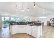 Kitchen and Living Area. - Single Family Home for sale at 62 Tarpon Way, Placida, FL 33946 - MLS Number is D6121925