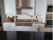 There is a faucet that allows you to easily fill your pots with water while they are on the stove. - Single Family Home for sale at 1900 Illinois Ave, Englewood, FL 34224 - MLS Number is D6121965