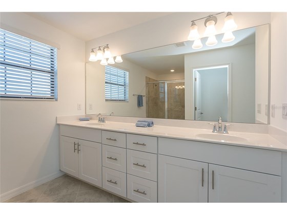 Master bathroom with dual sinks - Single Family Home for sale at 1837 East Isles Rd, Port Charlotte, FL 33953 - MLS Number is D6122330