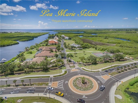 The entrance to Lea Marie Island from Edgewater Drive in Port Charlotte, Florida, showing the East Spring Waterway to the left that leads to the Peace River and Charlotte Harbor, then on to the Gulf of Mexico. - Vacant Land for sale at 4030 Lea Marie Island Dr, Port Charlotte, FL 33952 - MLS Number is C7404124