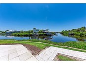 That's the gated community, Bella Sole, across the canal. - Single Family Home for sale at 602 Regatta Way, Bradenton, FL 34208 - MLS Number is A4499642