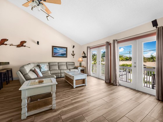 Sun-filled space with soaring ceilings. - Condo for sale at 6810 Midnight Pass Rd, Sarasota, FL 34242 - MLS Number is A4507853
