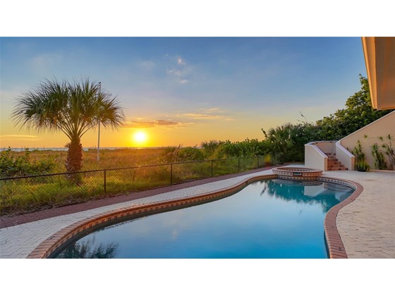 Sunset Northwest view - Single Family Home for sale at 6211 Gulf Of Mexico Dr, Longboat Key, FL 34228 - MLS Number is A4511733