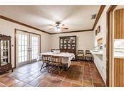 French doors lead from dining room out to wood deck - Single Family Home for sale at 7700 Iguana Dr, Sarasota, FL 34241 - MLS Number is A4512842