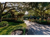 Stately entrance to Gator Creek, which is gated at night. - Single Family Home for sale at 7700 Iguana Dr, Sarasota, FL 34241 - MLS Number is A4512842
