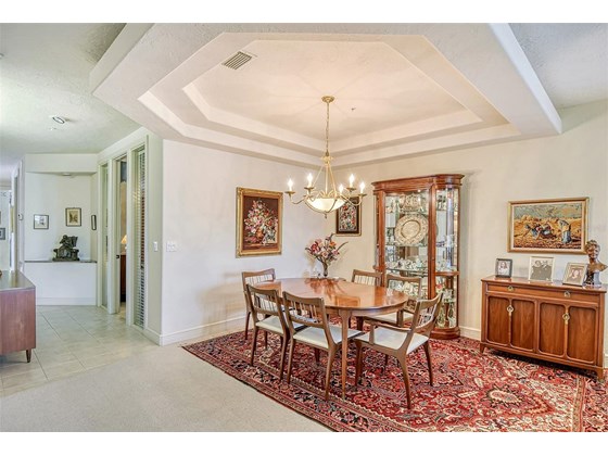 Dining area showing gallery hall - Condo for sale at 370 A Gulf Of Mexico Dr #421, Longboat Key, FL 34228 - MLS Number is A4513966