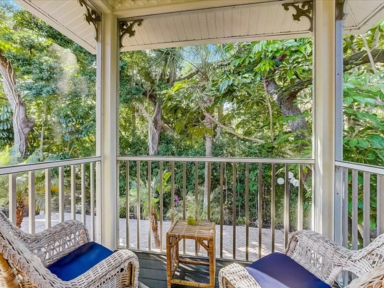 Private screened in balcony overlooking courtyard from the Owner's suite - Single Family Home for sale at 5227 Siesta Cove Dr, Sarasota, FL 34242 - MLS Number is A4519271